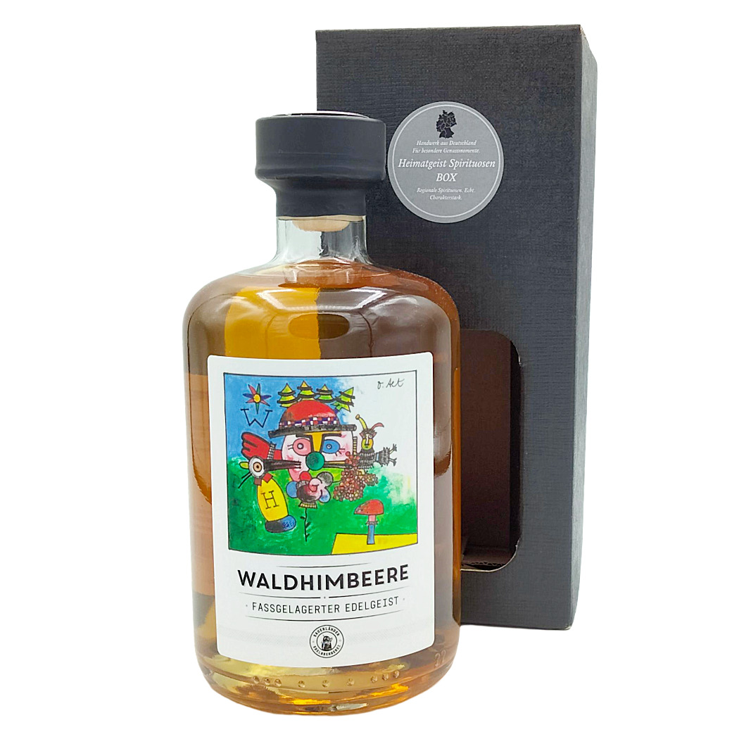 Waldhimbeere Fassgelagerter Edelgeist in dekorativer Flasche mit farbigem Etikett und Geschenkbox.