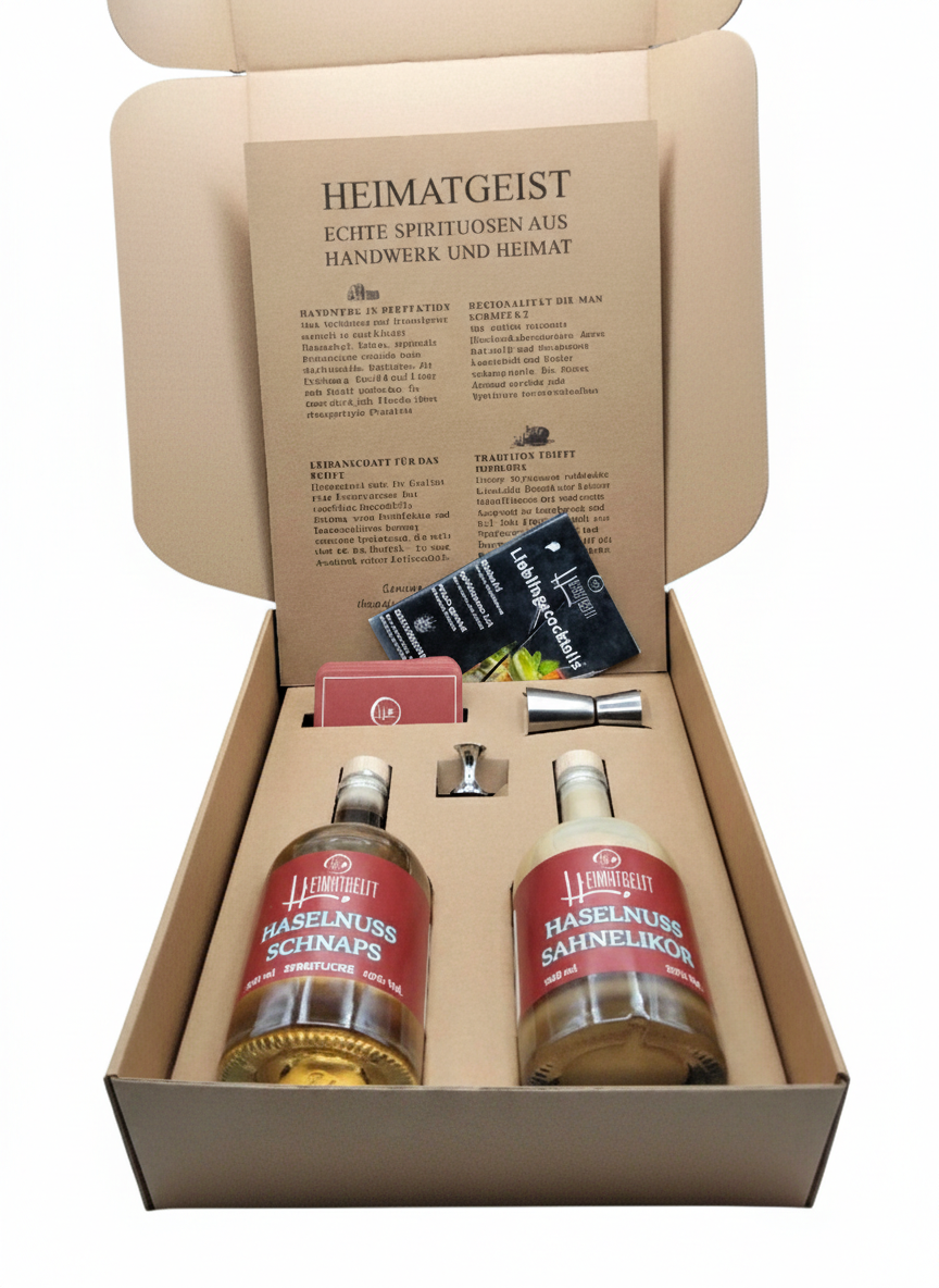 Heimatgeist Geschenkset mit Haselnuss Schnaps und Sahnelikör in einer eleganten Verpackung.