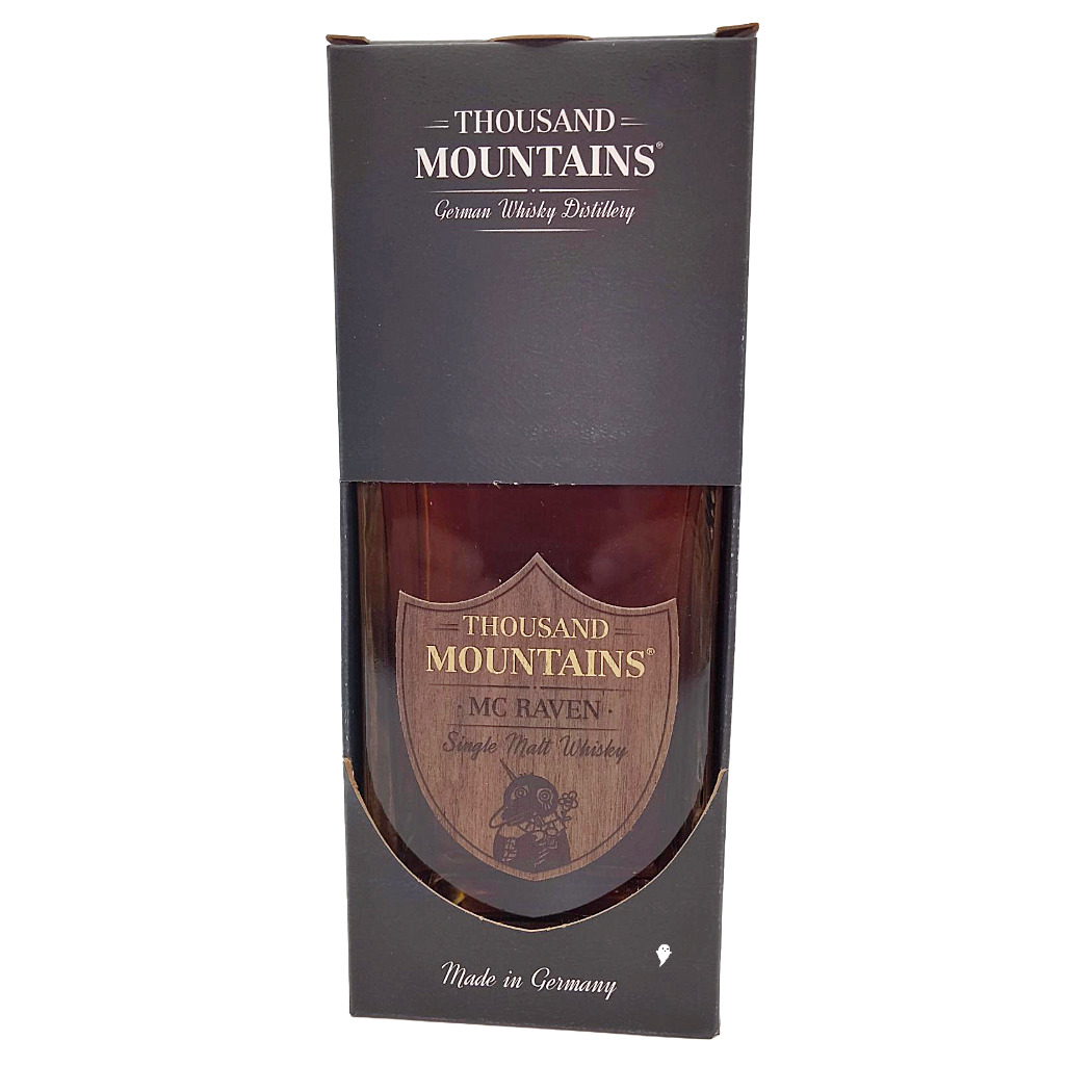Thousand Mountains MC Raven Single Malt Whisky in eleganter Verpackung, hergestellt in Deutschland.